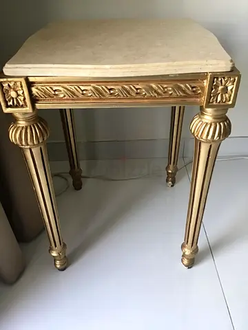Gold ornate side table with marble top