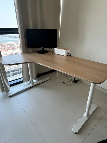 IKEA L-shaped wooden office desk with white metal legs - good condition