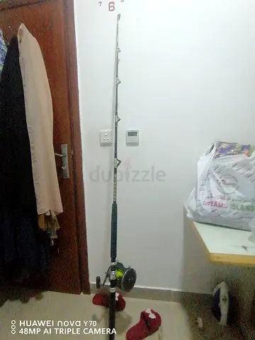 Sturdy Fishing Rod with Attached Reel and 2 metal holders big cheap price