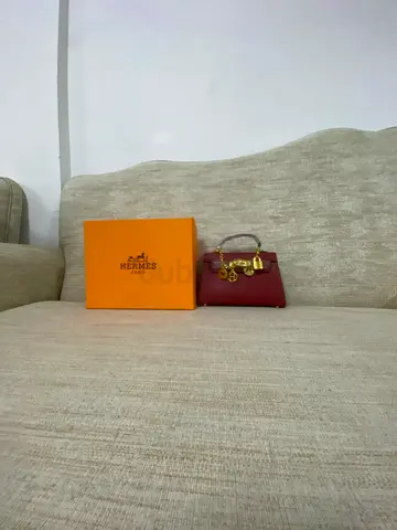 Small red Hermes-style leather handbag with box