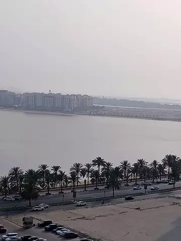 Annual rent in Al Khan Corniche, Sharjah. One bedroom apartment with a spacious living room, kitchen, bathroom and central AC. Parking available for a