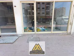 Commercial shops with mezzanine floors in a prime location in Al Rashidiya 2, offering a unique busi