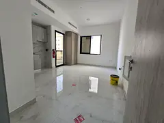 High-end Ajman apartment with a balcony offering excellent views. First occupancy. Central air condi