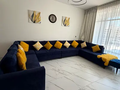 Large L-shaped Navy Blue Fabric Sofa with Yellow Cushions - Good Condition