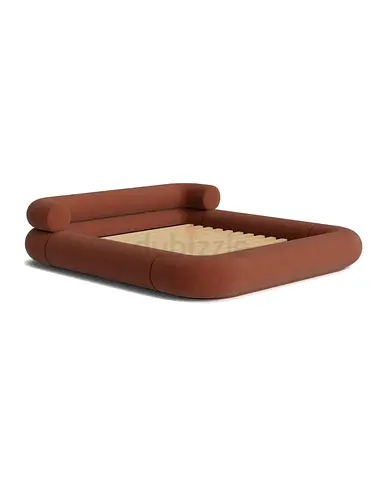 Modern low-profile upholstered bed frame in terracotta