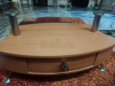 Low wooden TV/entertainment stand with metal legs and drawer