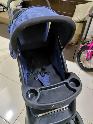 Used navy standard Juniors baby stroller in good condition