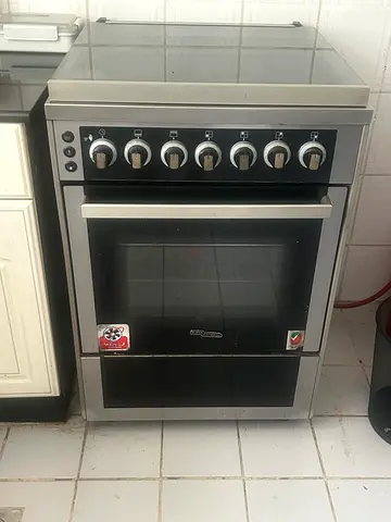 Used freestanding electric oven with 6 control knobs — good working condition