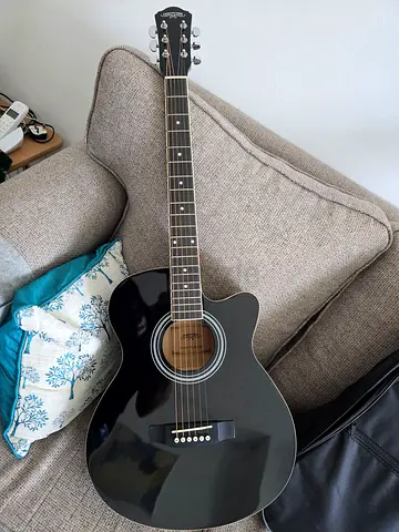 Black Acoustic Guitar with Case and accessories- Used Once. (Teach a new skill to your kids this su)
