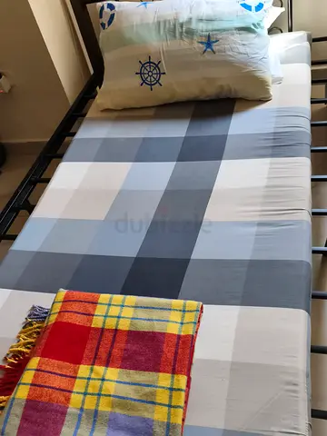 Single metal bed frame with mattress and bedding 2 pillows