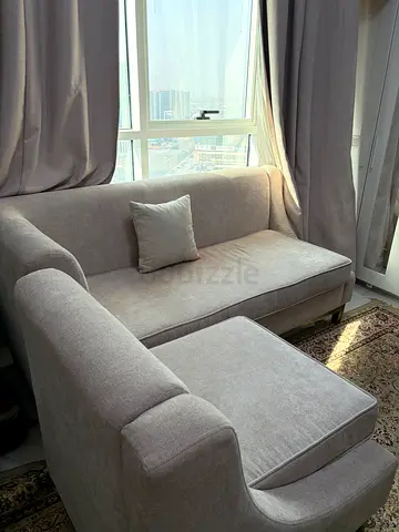Light grey 3-seater sofa with ottoman, good condition