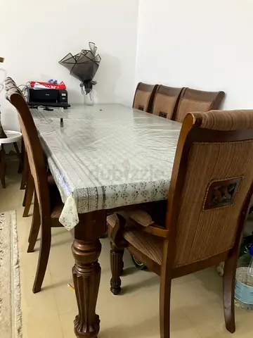 Excellent Malaysian wood dining table with chairs in great condition