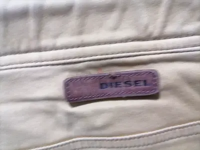 Diesel casual pants with leather logo patch size fit 30 to 32