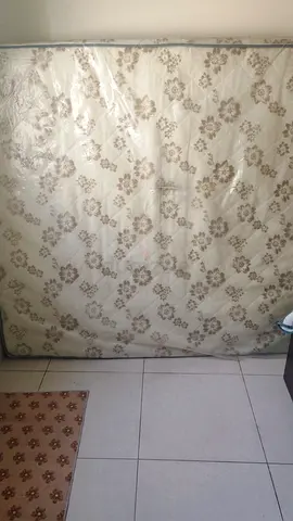 King size mattress in good condition (covered)