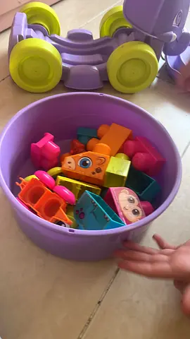 Lot of preschool shape toys and small figures in storage bucket