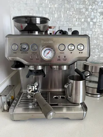 Breville stainless steel espresso machine with steam wand — used