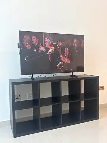 Samsung 50 LED TV mounted on stand with IKEA cabinet
