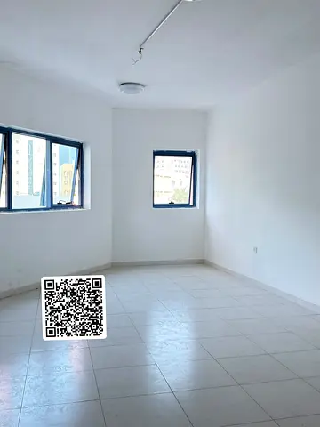 **For Annual Rent – Spacious Studio Apartment in Falcon Towers, Al Rashidiya 2, Ajman | Large Area | Closed Kitchen | Central A/C | Parking Inside the