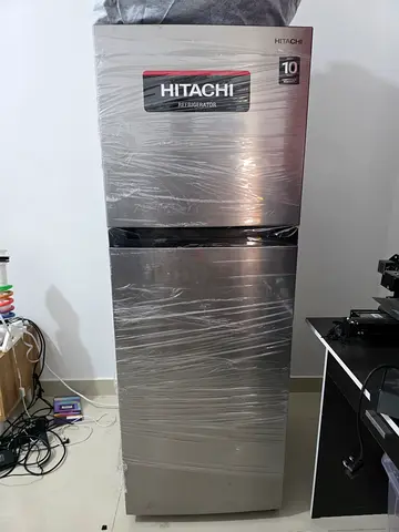 Hitachi stainless steel double-door refrigerator - good condition with 2 year extended warranty