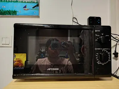 MOVING OUT SALE: Aftron countertop microwave oven