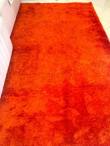 Orange shaggy rug - good condition, soft pile