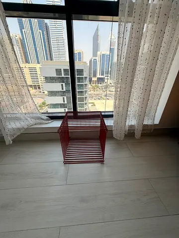 Red metal side table / magazine rack - compact modern design