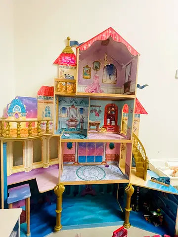 Kidkraft Large Multi-level Wooden Princess Dollhouse with 9 rooms, elevator and stairway.