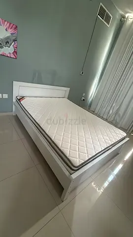 Excellent condition Queen size bed with Rebonded foam mattress. from Home Box. less than a year old.