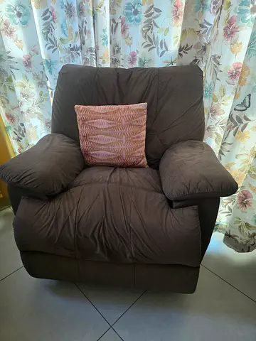 Comfortable single brown fabric rocking reclinar chair with cushion