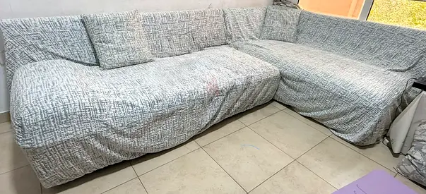 L-shaped fabric sofa with removable covers - good condition