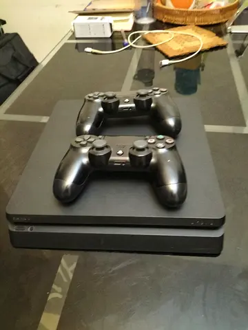 PlayStation 4 Slim with 2 DualShock Controllers - Good Condition