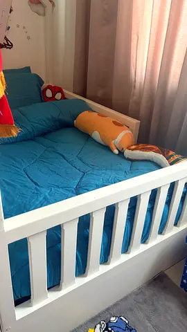 White wooden toddler bed with guard rails — good condition