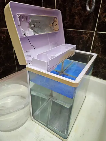 Small glass aquarium kit with lid, filter and accessories