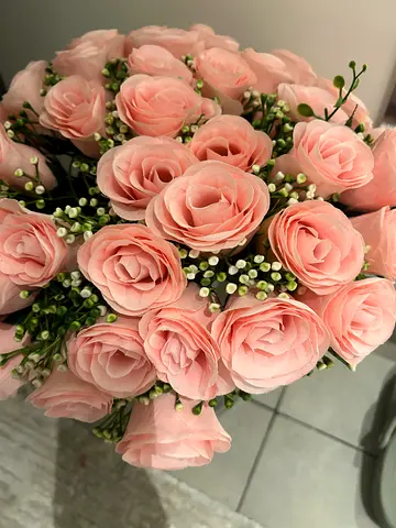 Artificial pink flowers and vase