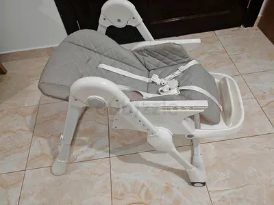 Adjustable Giggles baby high chair / convertible booster seat