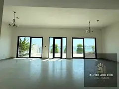 Luxury 5BR villa with private beach in Al Hamriyah, two gardens, sea‑view balconies, large rooftop