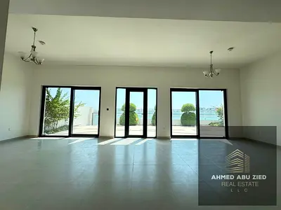 Luxury 5BR villa with private beach in Al Hamriyah, two gardens, sea‑view balconies, large rooftop, central AC, two free months, AED 250,000, 4 paymen