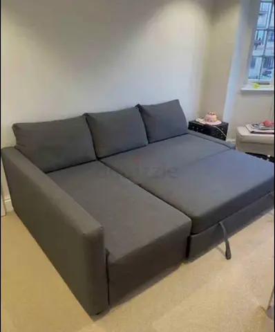 Grey L-Shaped Sofa Bed with Pull-Out Section
