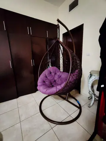 Free-standing hanging egg chair with purple cushion — good condition
