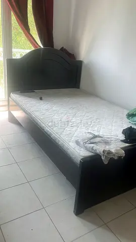 Dark wooden single bed frame with mattress - good condition
