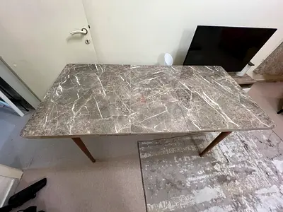 Dining table with wooden legs - good condition. Top extendable. Only table without chairs.