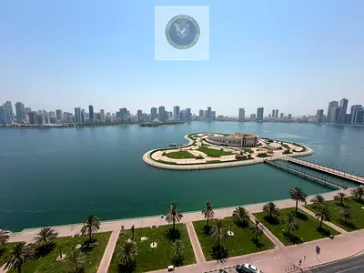 Two bedroom apartment with living room for annual rent in Al Majaz 3 Sharjah free air conditioning free parking maintenance included maid room built i