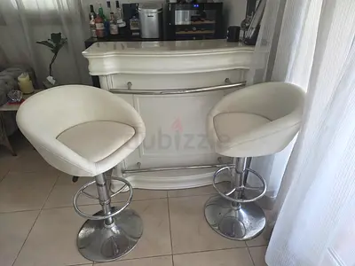 Pair of white swivel bar stools with chrome base - good condition