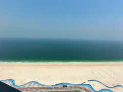 Three-bedroom apartment in Ajman Corniche Towers, sea view, spacious layout, balconies, gym, pool, p