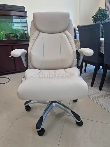 Beige Ergonomic Office Chair with Adjustable Armrests and Wheels
