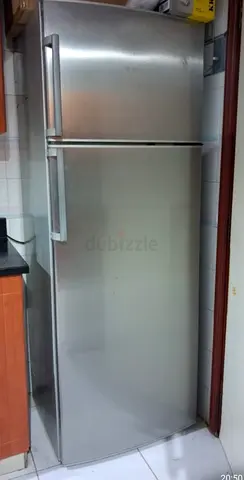 Silver top-freezer refrigerator - good working condition