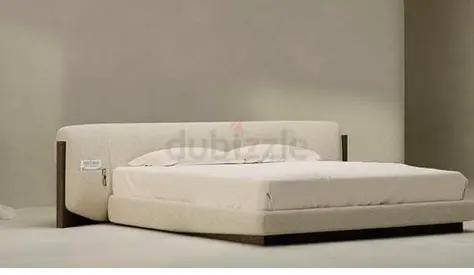 Low-profile upholstered king bed with padded headboard (beige)