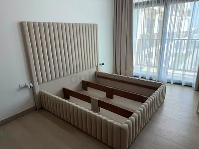 King Size bed with headboard.