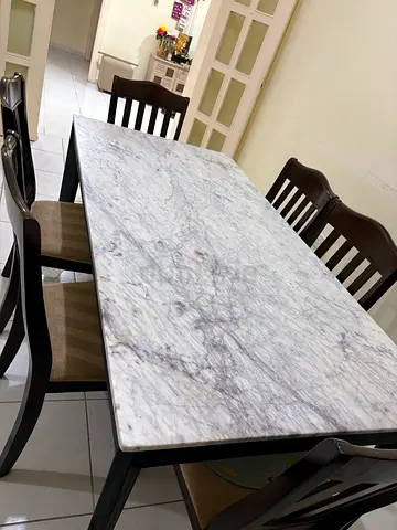 Marble-top dining table with 6 chairs - dark wood frame