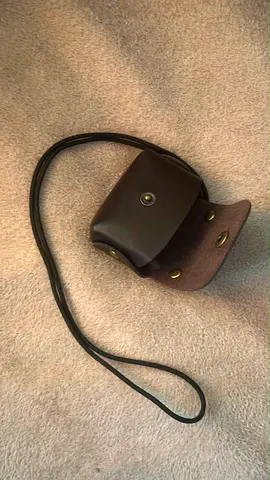 Small brown leather crossbody AirPods pouch with strap